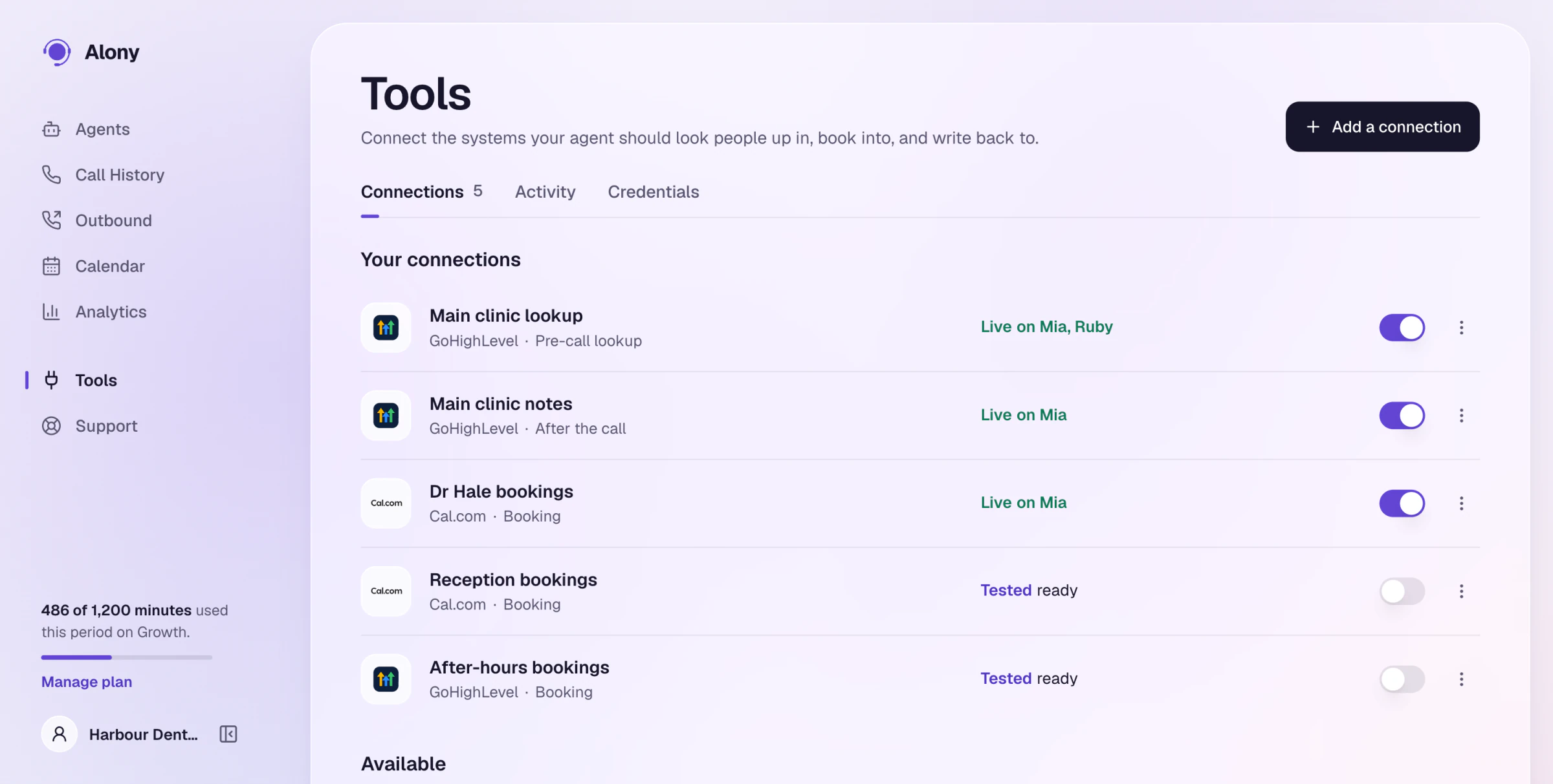 The Tools tab with GoHighLevel and Cal.com live on two agents